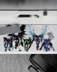 36x16 inches anime desk pad in black, green, and steel gray with icy blue wing glow, fast heroic vibe.