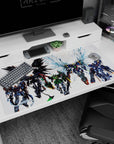 Massive mecha with shattered-glass blue wings leading a squad on an anime desk pad, 40x20 inches.