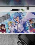 Anime mouse pad 40x20 inches featuring KonoSuba's Aqua, Megumin, Darkness, and Kazuma against a vibrant cityscape.