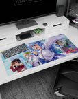 Anime mouse pad 36x16 inches featuring KonoSuba's Aqua, Megumin, Darkness, and Kazuma in vibrant cityscape.