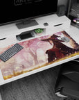 Konosuba anime mouse pad 40x20 inches featuring Megumin under sakura tree, pink petals in golden light for a serene desk.