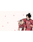Anime volleyball teammates desk pad 40x20 inches, spiky ace in red jersey hugs grumpy blond on pink.