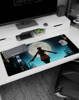 Confident ponytailed anime girl with twin pistols under a full moon on desk pad 36x16 inches.