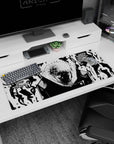 Artistic 36x16 inches desk pad with black-and-white Jujutsu Kaisen design, embodying cursed energy and the soul’s dark contours.