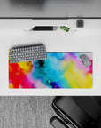 Colorful 28x12 inches mouse pad with an abstract blend of blues, reds, and yellows, perfect for creative desk setups.