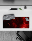 Moody wine-red and near-black desk mouse pad 28x12 inches with warm cinematic, mysterious space vibes.