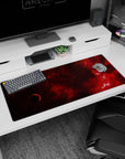 Lone shadowed planet in a red nebula starfield desk pad 36x16 inches, hypnotic space scene.