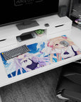 36x16 inches anime desk pad showing blonde with bunny clip and silver-haired girl adventuring in sky.