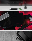 Mysterious 40x20 desk pad showcasing Obito Uchiha's intense red hues and dark cloak for anime fans