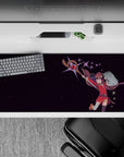 Megumin from Konosuba anime desk pad 36x16 inches with deep plum stars and energy sparks, capturing explosive charm.
