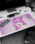Large 40x20 inches mouse pad featuring anime design, with violet-pink glow and smirk for a striking, playful, and rebellious look.