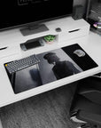 Eerie 32x16 mouse pad featuring a ghostly figure in monochrome tones with a red gaze, adding a mysterious and unsettling touch to your workspace