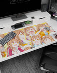 Brown-haired, golden-eyed anime girl popping through moods on desk pad 40x20 inches, snack and blush.