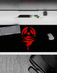 Anime desk pad 36x16 inches featuring Uchiha clan crest from Naruto; red-on-black design for fans of bold, mysterious setups.