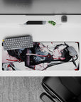 32x12 inches anime desk mouse pad in white with drifting petals, crisp black lines, and candy-red accents.