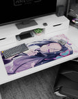 36x16 inches anime desk pad showing sleepy violet-eyed girl lying sideways, hair fanned out, petals drifting.
