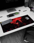 Anime desk pad 36x16 inches featuring Itachi Uchiha from Naruto, framed by a blood-red moon and crows, exuding power.