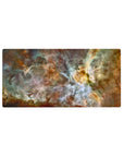 Large 32x16 inch mouse pad with cosmic nebula design in teal, gold, and white tones for an elegant desk setup.