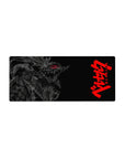 Mouse pad featuring a monstrous figure, 28x12 inches, with glowing red eyes and jagged armor for intense, high-contrast style.