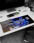 Anime girl 36x16 inches desk pad featuring wind-swept hair over water, glowing blue ribbon streaks.