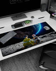 40x20 inches anime desk pad showing spiky-haired boy and pink-bob girl on moon, watching giant planet.