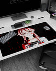 40x20 inches desk pad showing a pink-haired anime girl staring forward, tiny ribbon detail, red splatter.