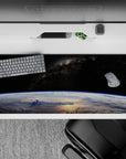 Velvet-black 36x16 inches desk pad with cool blue Earth glow and soft clouds for a calm, epic mood.
