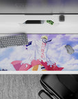 Anime desk pad 36x16 inches in soft blue sky tones with clouds, crisp white coat and heroic village vibe.