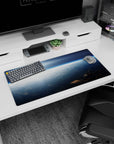 Blue sky above clouds with bright sunrise and small space station corner mouse pad, 32x16 inches.