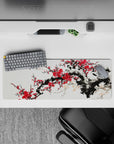 Intense 32x12 desk mat features plum blossoms and brushstrokes with intricate details for fans of tradition