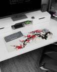 Small but impactful 32x12 desk mat showcases artistic resilience with striking red and ink artistry