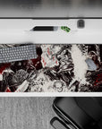36x16 inches desk pad showcasing Guts' intense battle with inner and outer demons, with black-and-white artwork and crimson accents.