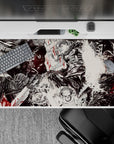 40x20 inches desk pad showcasing Guts' struggle against fate, with black-and-white artwork and crimson accents reflecting his battle with inner and outer demons.