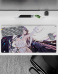 Albedo from Overlord in an angelic pose on a 32x16 inch mouse pad, with flowing hair and wings, set against a feathered background.