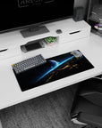 Blue planet over a glowing horizon on a 28x12 inches mouse pad, with tiny stars and shattered skyline.
