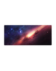 Galaxy nebula mouse pad 28x12 inches with starry midnight blues, magenta clouds, and golden center glow.