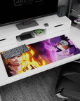 36x16 inches Naruto Uzumaki and Sasuke Uchiha desk mat, flames vs purple aura split sky scene.