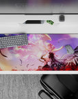 Anime girl desk pad 36x16 inches in dreamy purple-peach haze with glowing pink highlights and soft clouds.