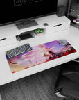 32x12 inches anime mouse pad showing angelic girl in white and pink facing a dark winged girl above lilies.