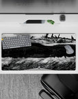 32x16 inches anime mouse pad in ink-black shadows and bright steel highlights, moody high-contrast art.