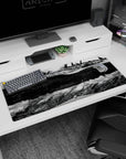 36x16 inches anime desk pad showing the ship’s engine-packed underside above streets with curling smoke ribbons.
