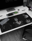 Emilia with Rem and Ram on a 40x20 inches anime girl desk pad, cozy gothic-cute desk scene.