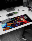 Megumin from Konosuba casting Explosion in neon colors on a 36x16 inch anime mouse pad, adding vibrant style to your desk.