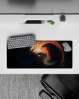 Calm dreamy desk mat mouse pad 28x12 inches in smoky black and starry navy with warm orange accents.