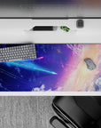 Dreamy cosmic desk pad 36x16 inches in deep blue, violet, and peach sunrise glow.