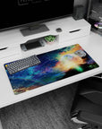 Cosmic horizon mouse pad 32x16 inches featuring a glowing planet halo above gold clouds and tiny stars.