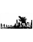 32x16 inches anime mouse pad with kaiju silhouette over shattered city skyline, bold graphic poster style.