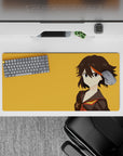 32x16 inches anime mouse pad in black, red and gold with bold, cocky vibe against bright orange.