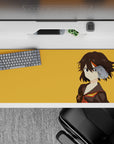 Bold orange and black anime desk pad 36x16 inches, fiery red-gold trim and cocky gamer vibe.