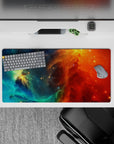 Dreamy bold 32x16 inches mouse pad in teal and ocean blues fading into fiery orange and red.